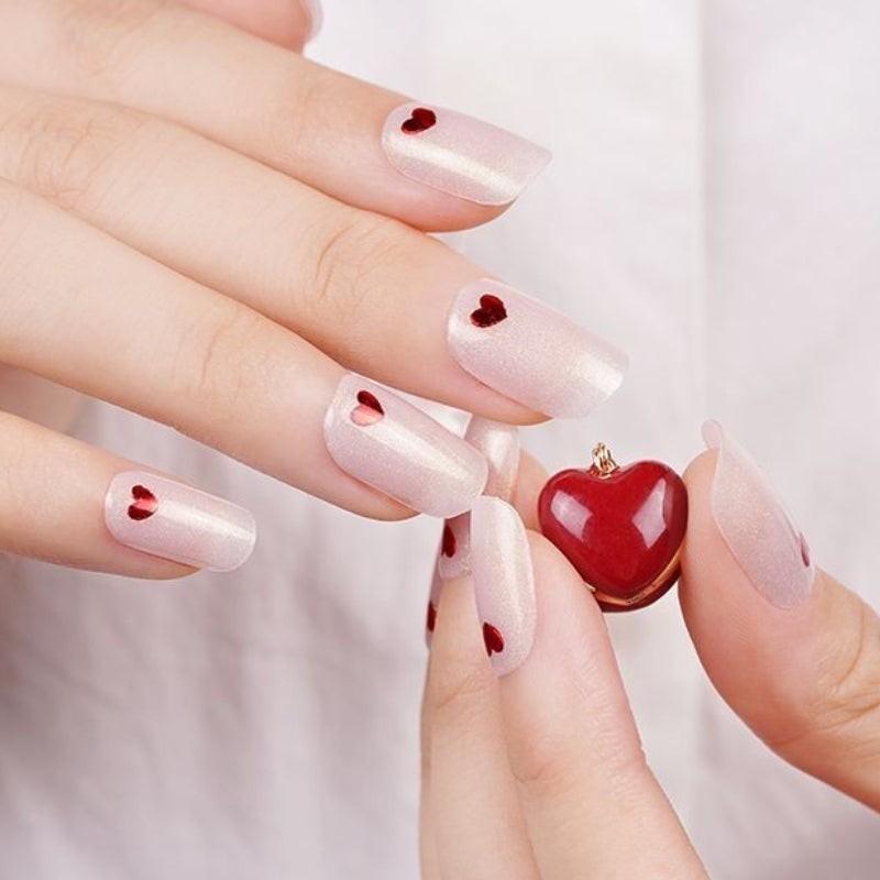 Kyco Nails Cotton Candy soft pink gel nail wraps with small red heart accents. Easy application, glossy finish.