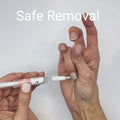 Removing semi-cured gel nail wraps using cuticle oil to gently lift product without damaging the natural nail